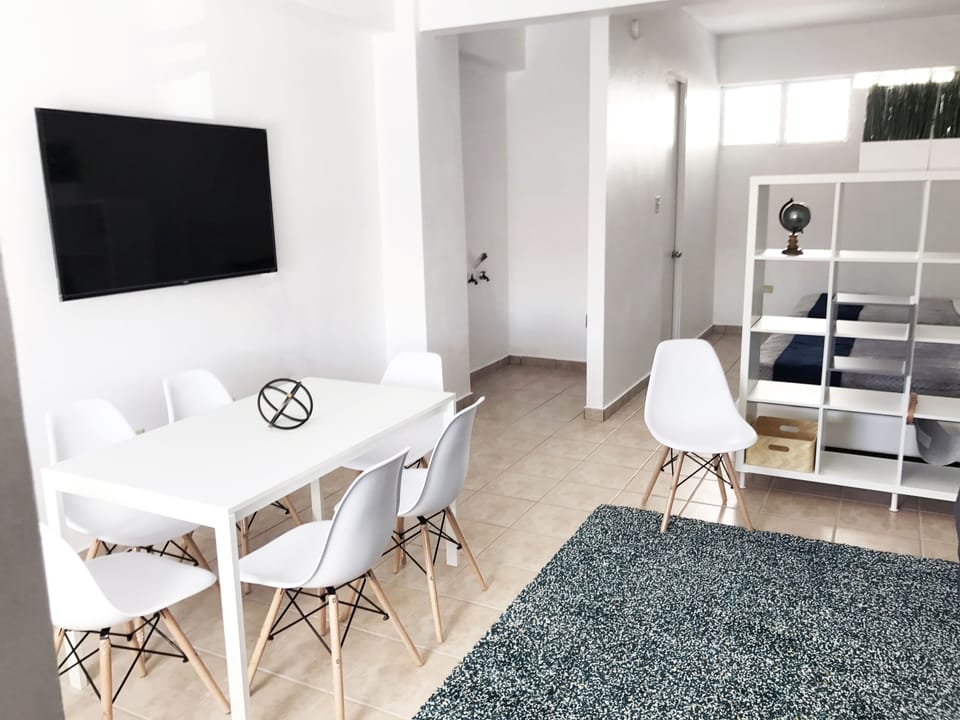 Studio, Multiple Beds | Living area | Flat-screen TV