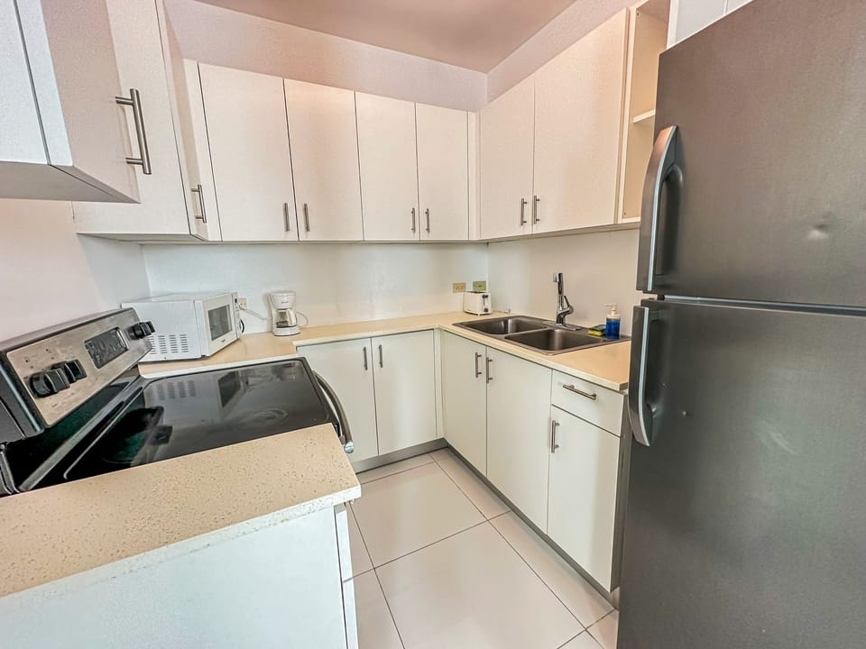 Fridge, microwave, stovetop, coffee/tea maker