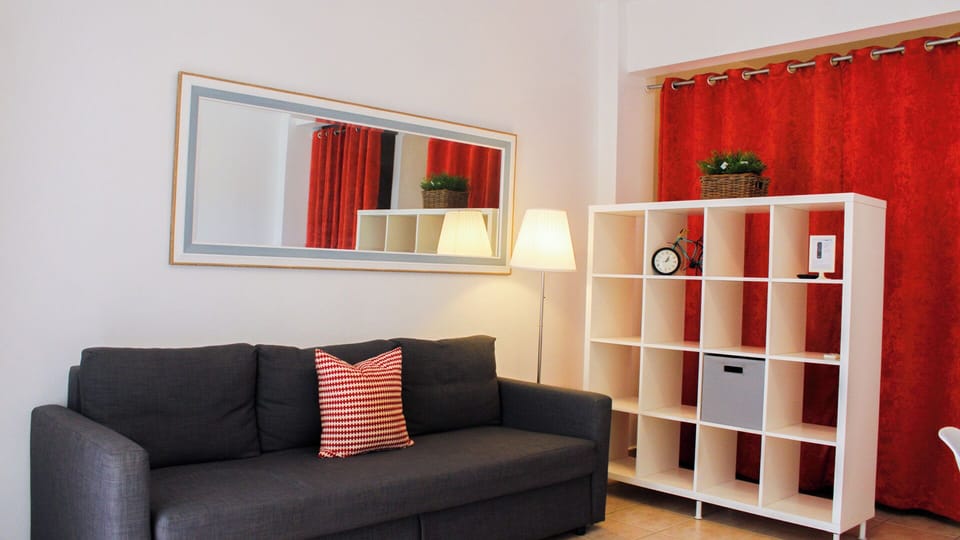 Studio, Multiple Beds | Living area | Flat-screen TV