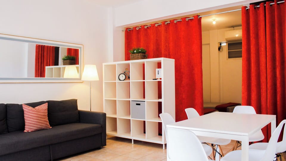 Studio, Multiple Beds | Living area | Flat-screen TV