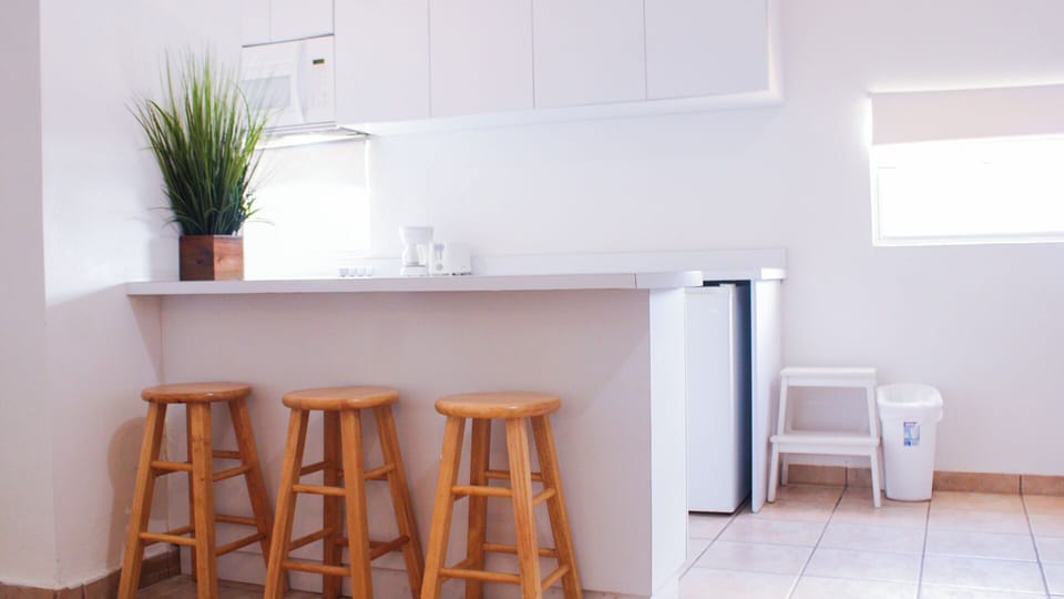 Fridge, microwave, stovetop, coffee/tea maker