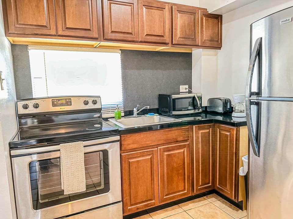 Apartment, 2 Bedrooms | Private kitchen | Fridge, microwave, stovetop, coffee/tea maker