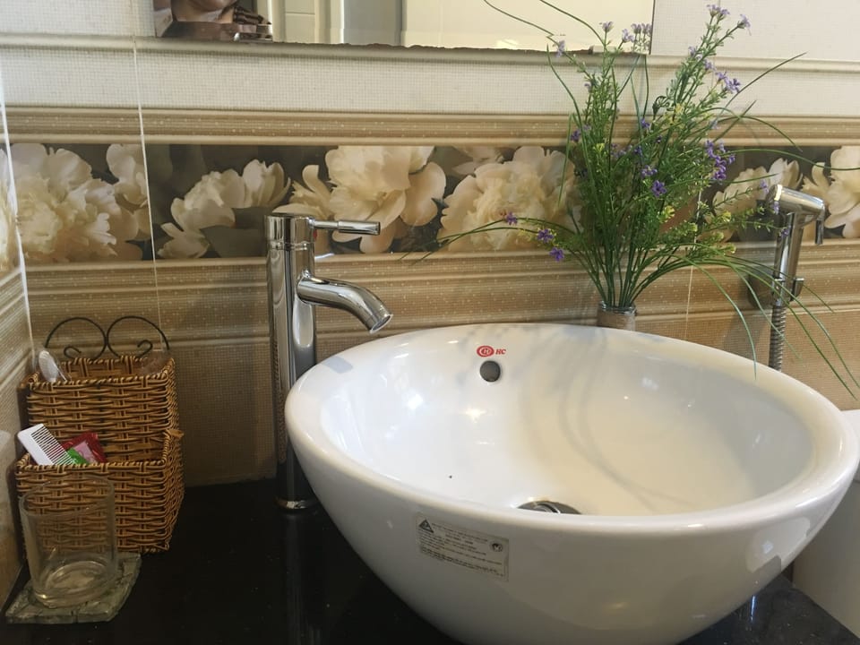Shower, free toiletries, hair dryer, slippers