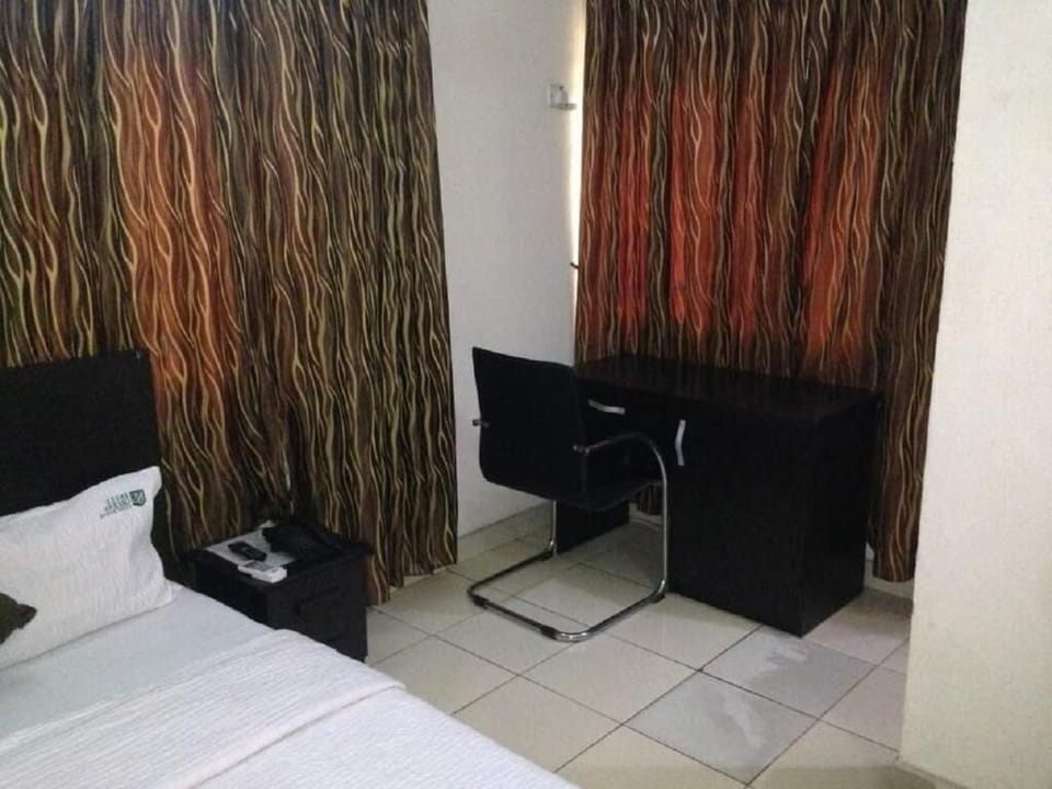 Minibar, desk, blackout drapes, iron/ironing board
