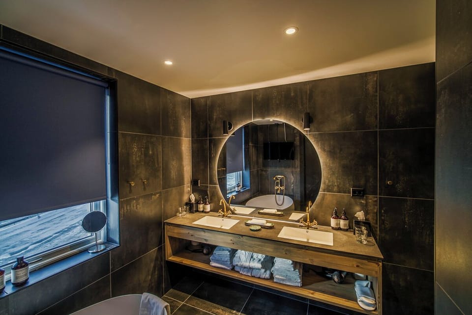 Shower, rainfall showerhead, designer toiletries, hair dryer