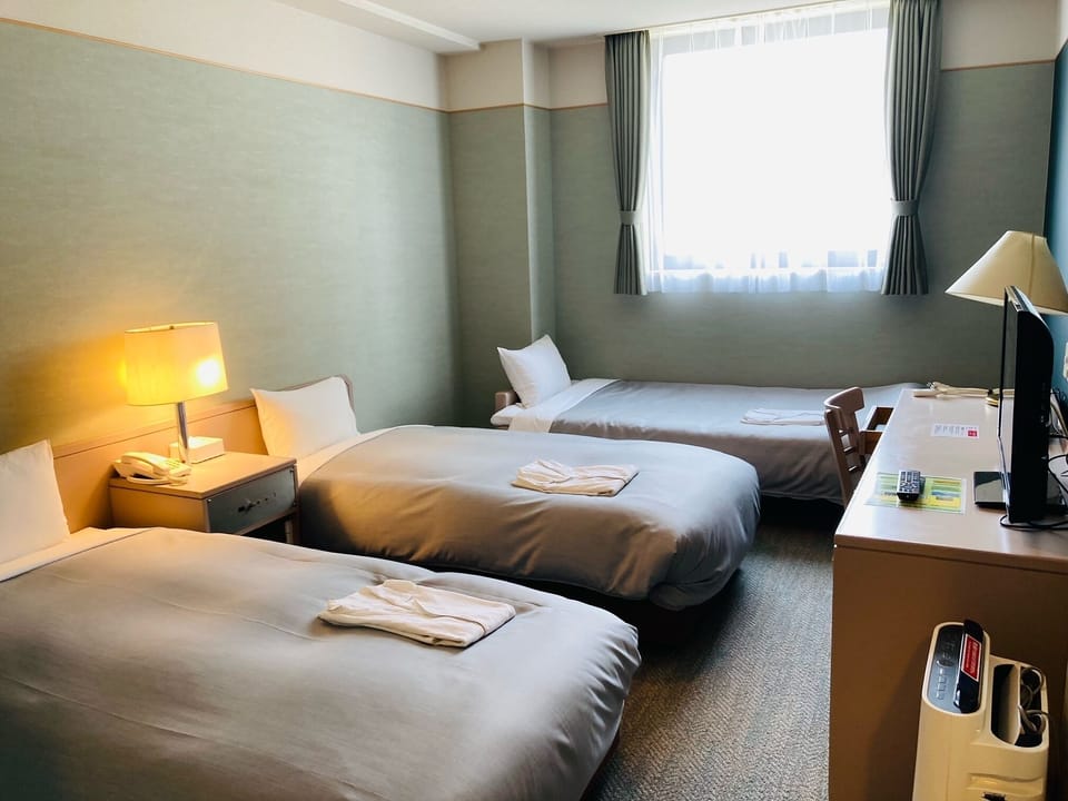 Triple Room, Multiple Beds | Iron/ironing board, free WiFi, bed sheets