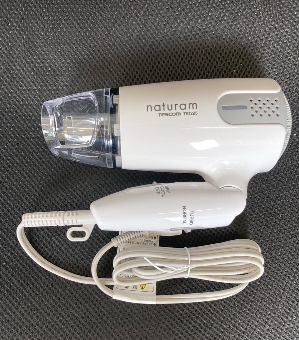 Combined shower/tub, free toiletries, hair dryer, slippers