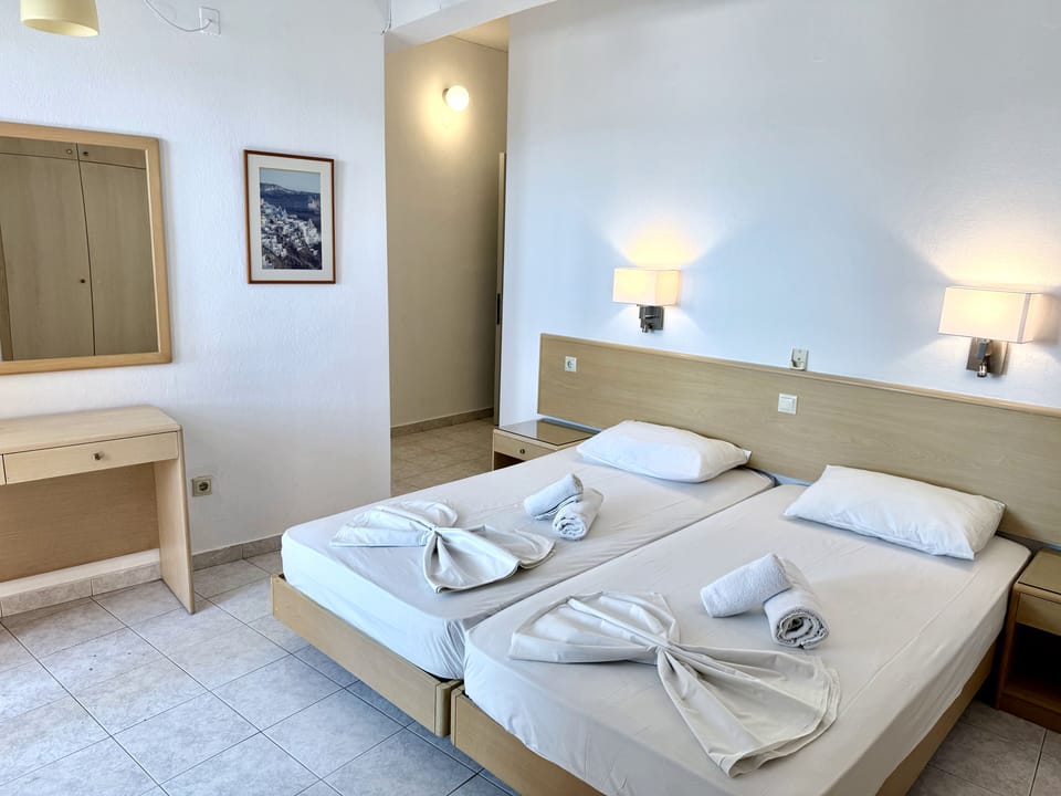 Family Room with City & Sea view | Pillowtop beds, desk, free WiFi, bed sheets
