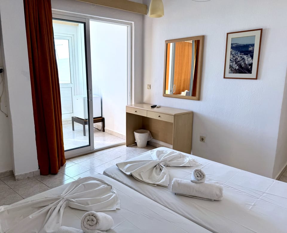 Family Room with City & Sea view | Pillowtop beds, desk, free WiFi, bed sheets
