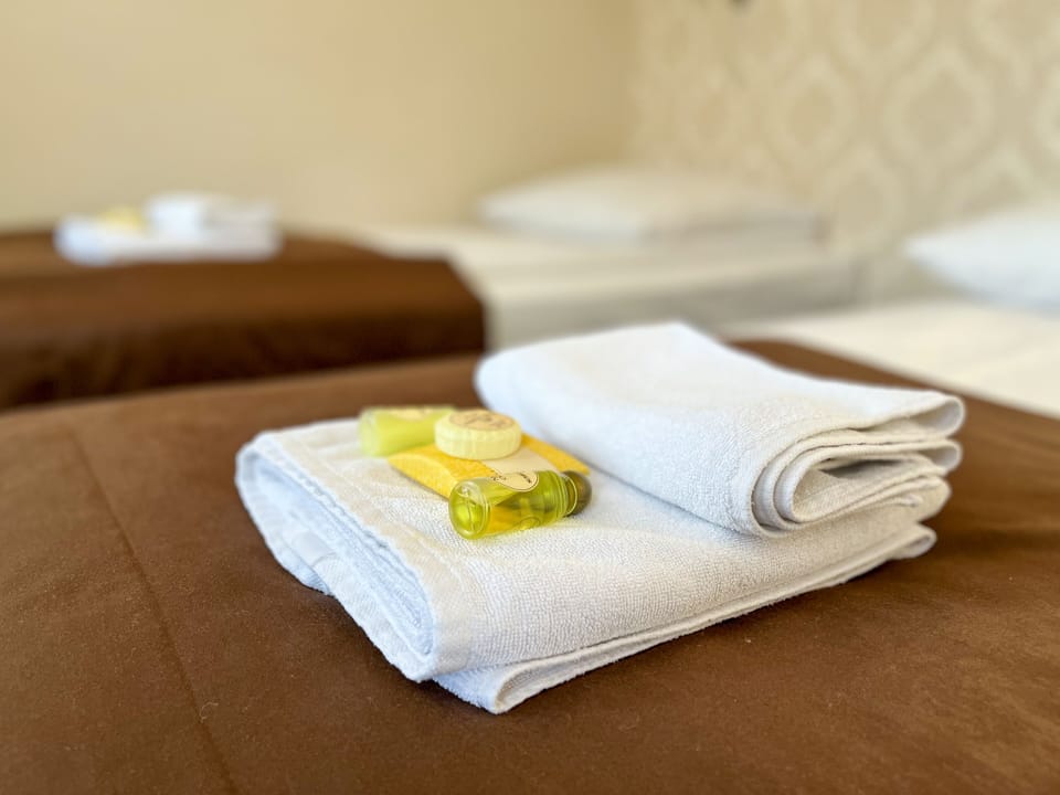 Quadruple Room | Select Comfort beds, in-room safe, desk, iron/ironing board