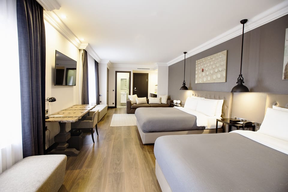 Family Suite, Multiple Beds | Minibar, in-room safe, desk, blackout drapes