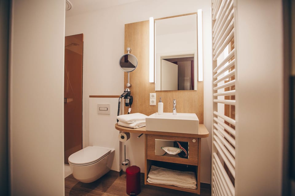 Shower, rainfall showerhead, hair dryer, towels