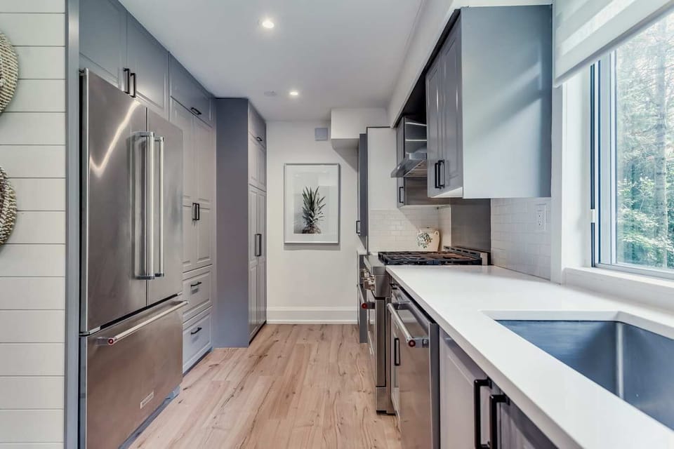 pantry and stacked washer and dryer 