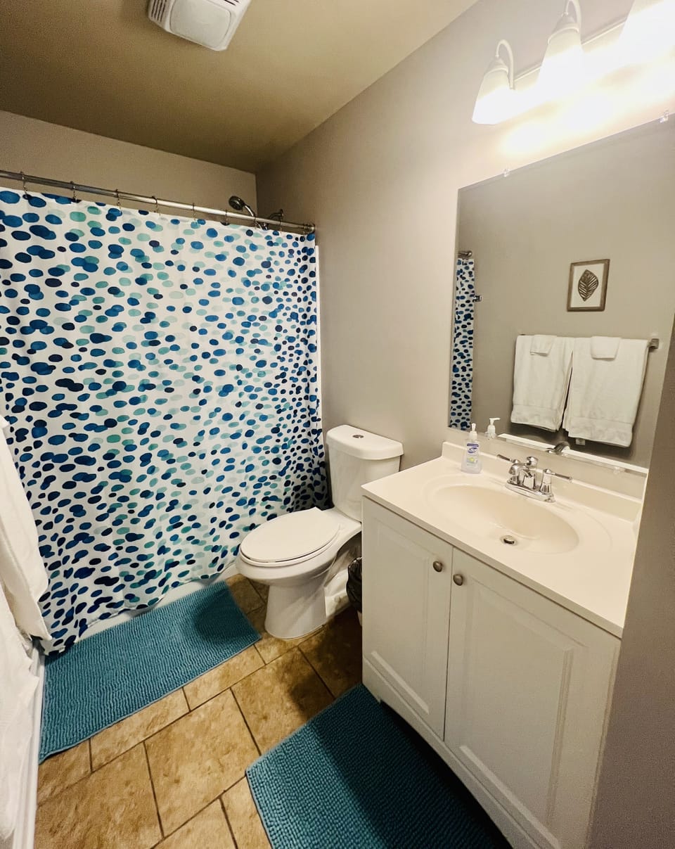New large mirror was put up in bathroom upstairs. 