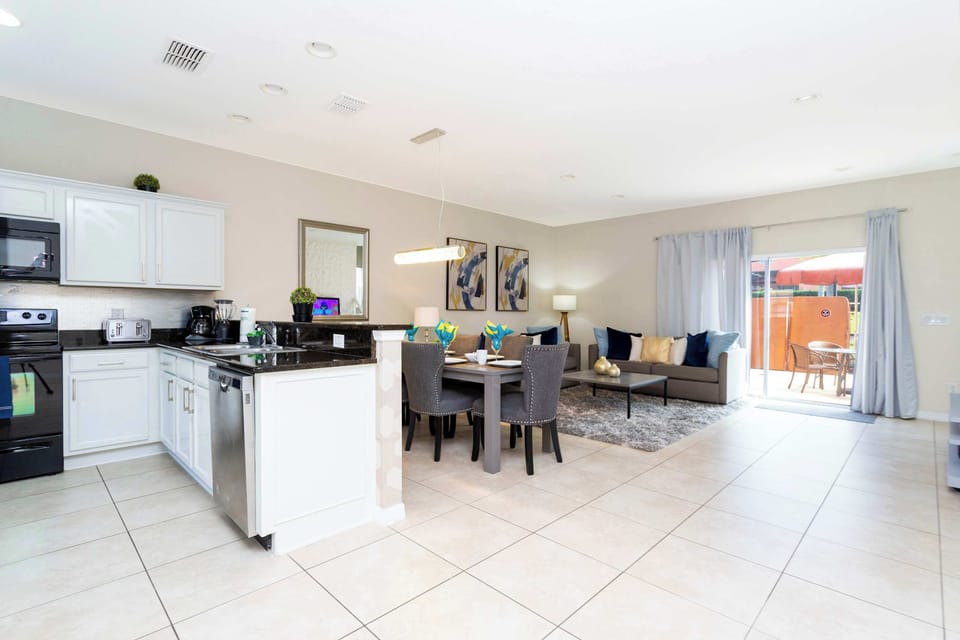 Open-Concept Living & Kitchen Space: Enjoy spacious comfort in this bright, stylish open-plan area perfect for socializing, relaxing, and creating memorable family meals.