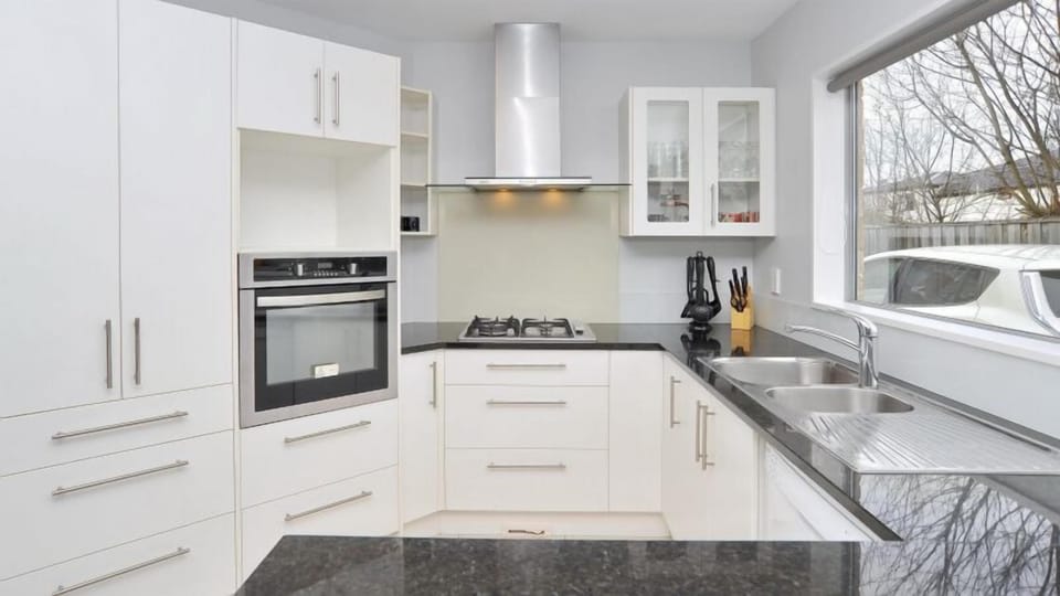 A proper kitchen for cooking real meals: gas hob, oven, rangehood, and a full-size fridge-freezer. Cooking in beats eating out every night.