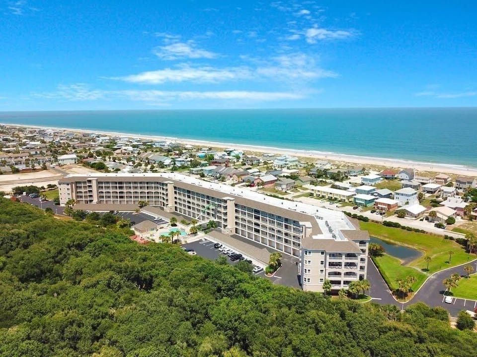 Backside of Condo Complex, Pool Area, and View of Ocean. 