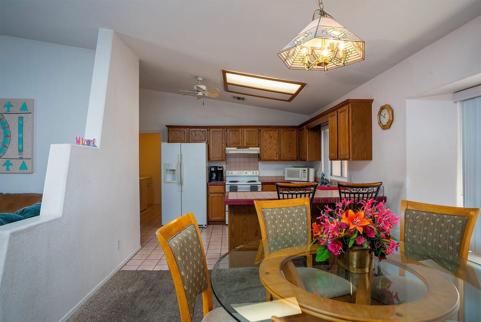 Formal   dining for 6 + 2  at bkfst bar plus living room/ coffee table/ outside.