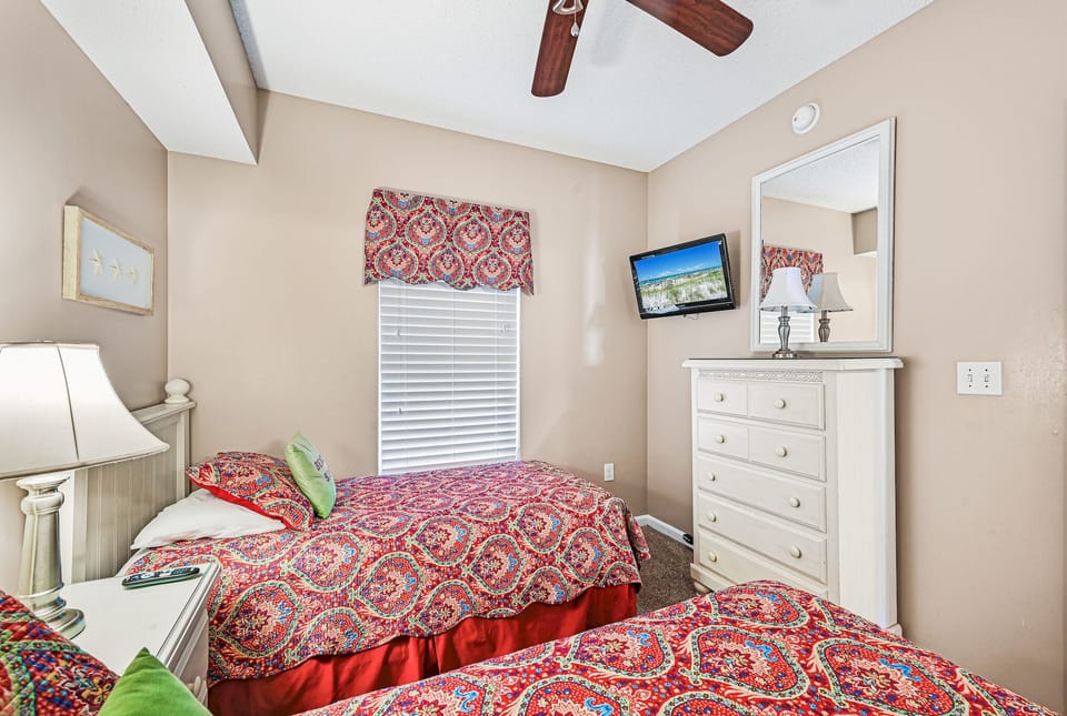 Twin beds with TV .
