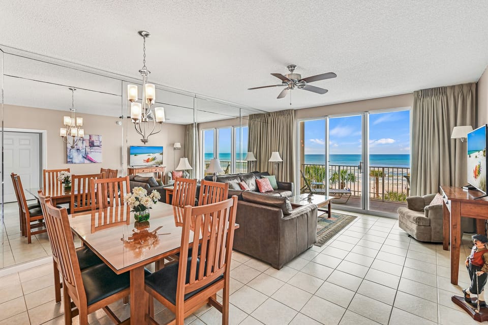 Dining area plus living area with TV.
Glass doors to the balcony.