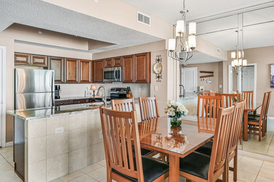 Kitchen with new granite counter top, new backsplash, and decor ceiling, light.