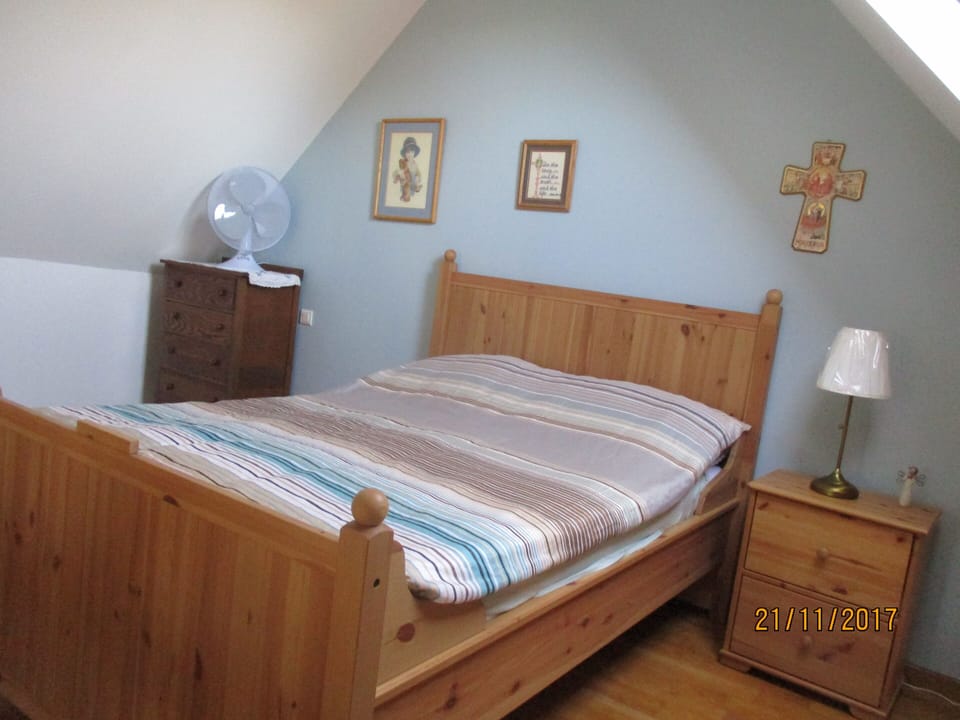 Loft with queen-sized bed, firm mattress.