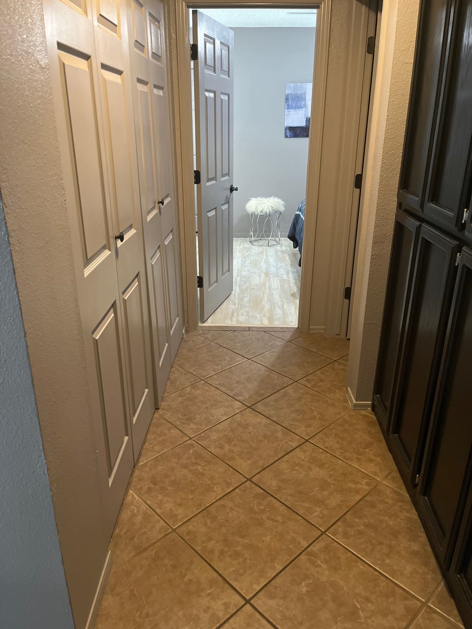 Hallway with Washer and Dryer and Cabinets for Storage
