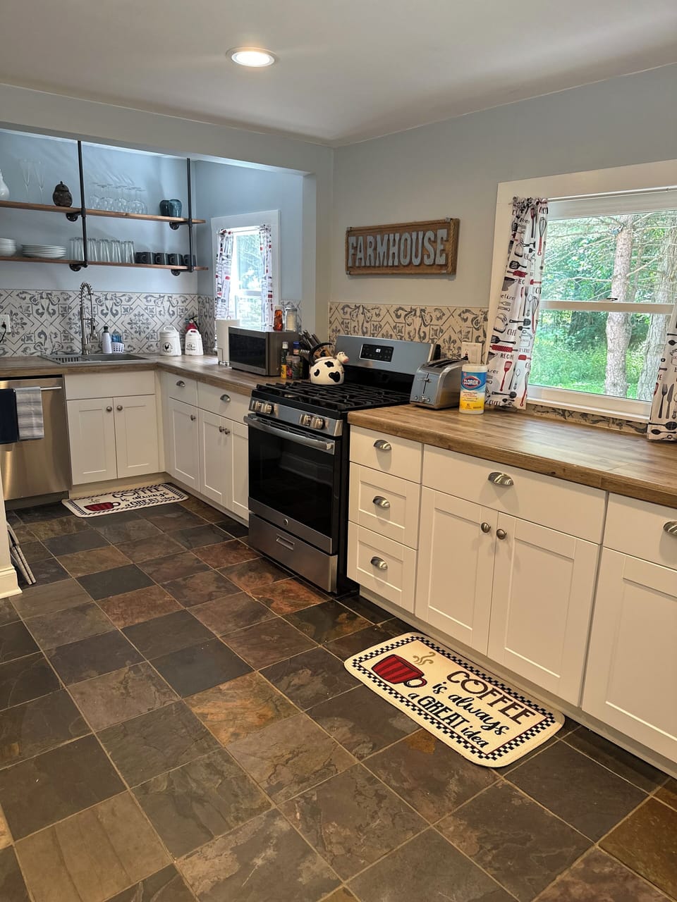 Fully stocked kitchen with stove and dishwasher 