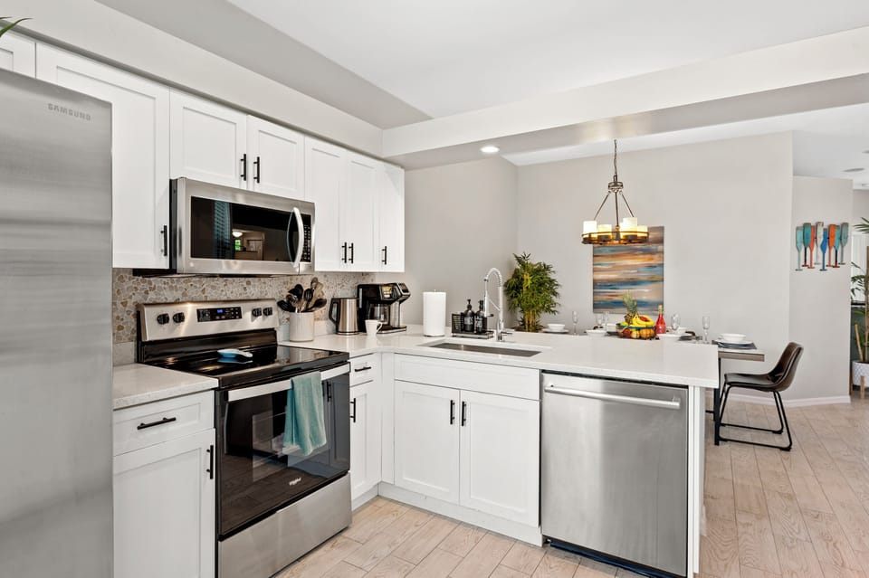 Bright and spacious kitchen with stainless steel appliances
