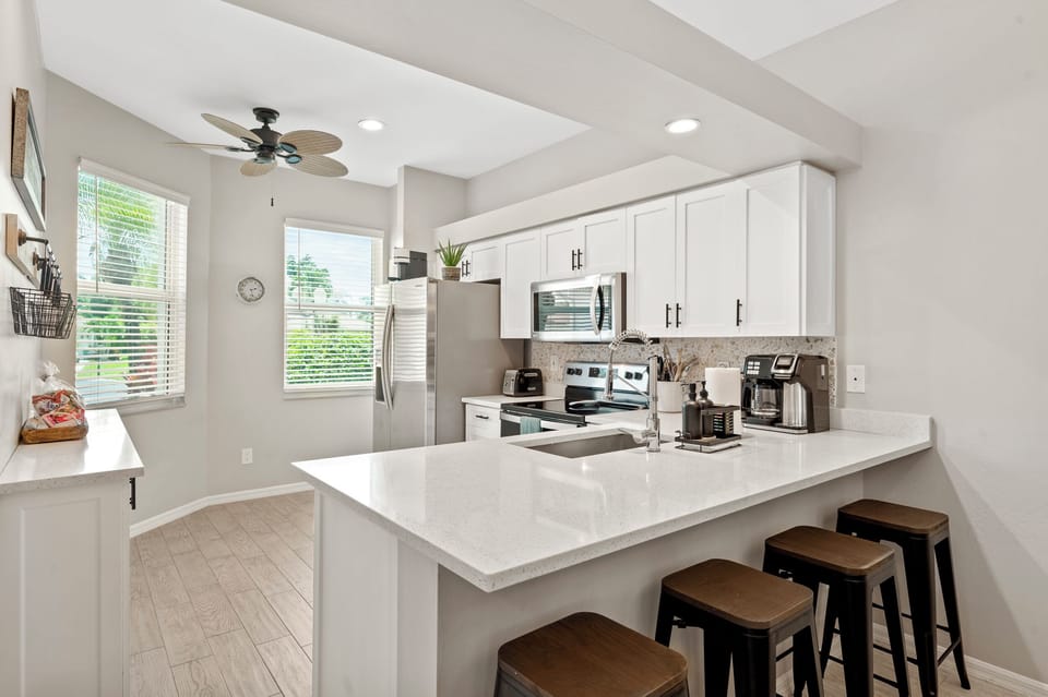Casual dining bar with seating for four and views into the heart of the home