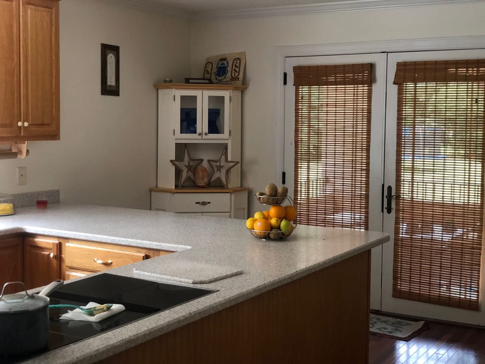 Kitchen Bar area with double door access to covered porch 