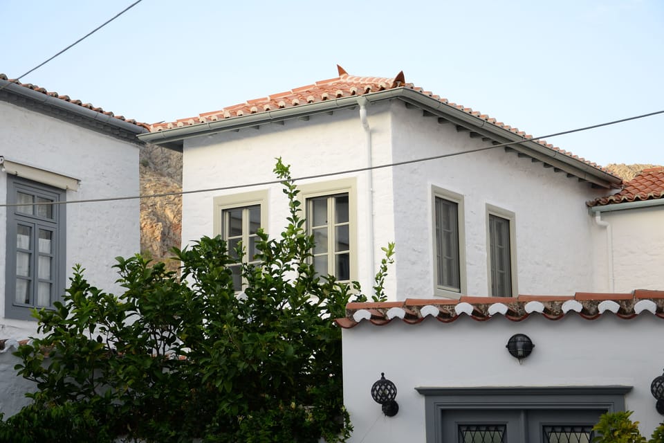 General view of the stone house from the cobbled path