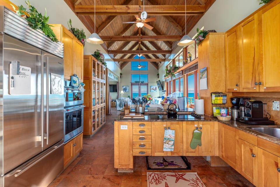 Kitchen with full-size Sub-Zero stainless steel refrigerator