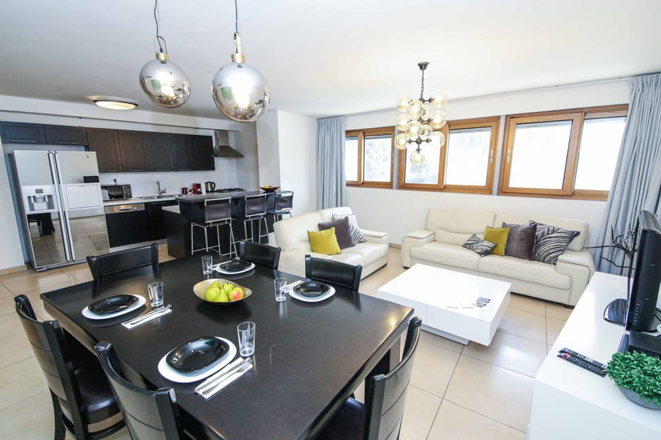 Luxury Apartment (104), 3 bedrooms, 1 living room | Living area | 50-cm flat-screen TV with cable channels, TV