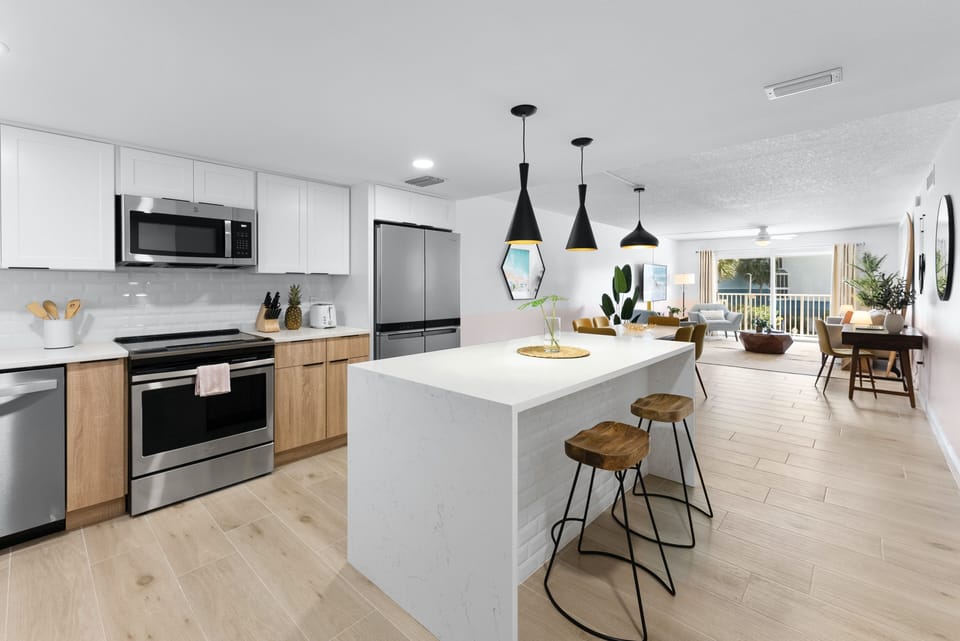Sleek modern kitchen with elegant lighting a spacious island and chic finishes