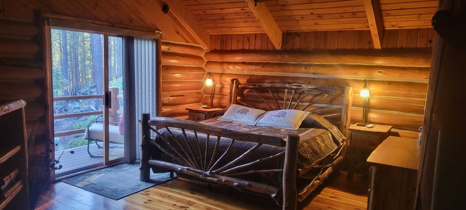 Master suite enjoys the cool evening air from patio door, on second floor