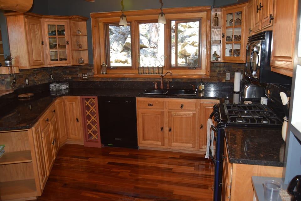 Modern appliances and fully stocked kitchen allow for meal prep with family.