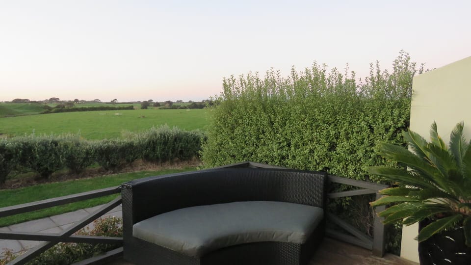 View down the farm towards the river from the comfortably furnished deck area