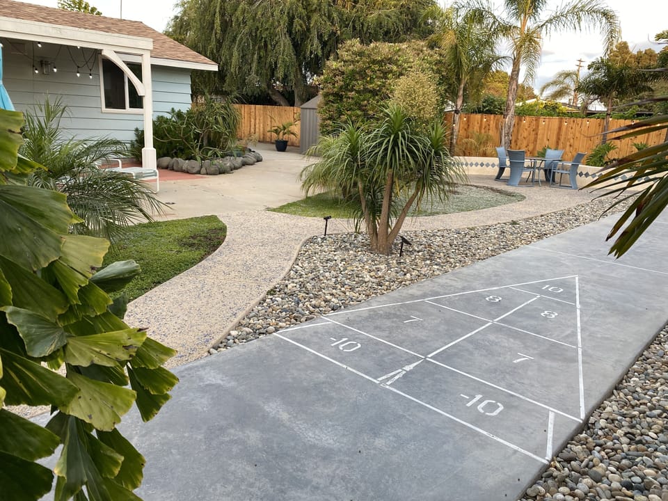 Private Backyard with patios and shuffle board