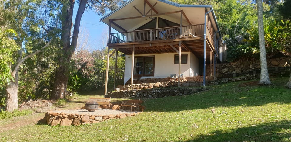 Lodge viewed from garden showing firepit.