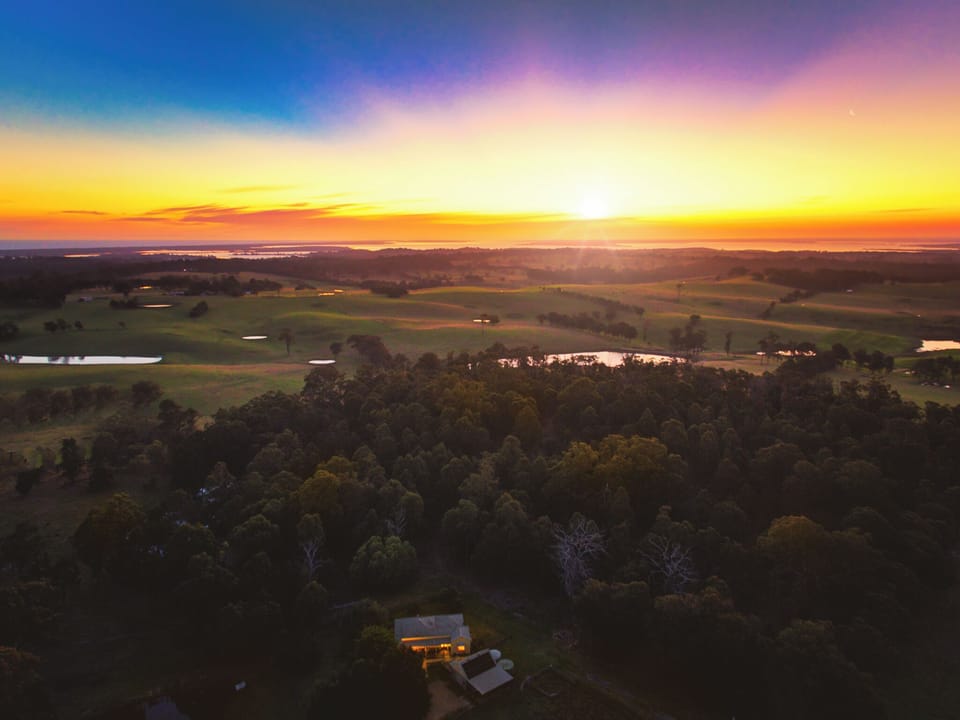 Drone image of the property, showing Gippsland Lakes in the background.
