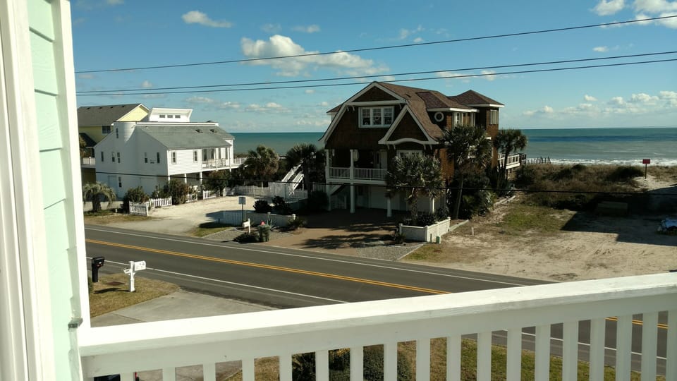 View from top deck.  Beach access is between the white and brown house across st