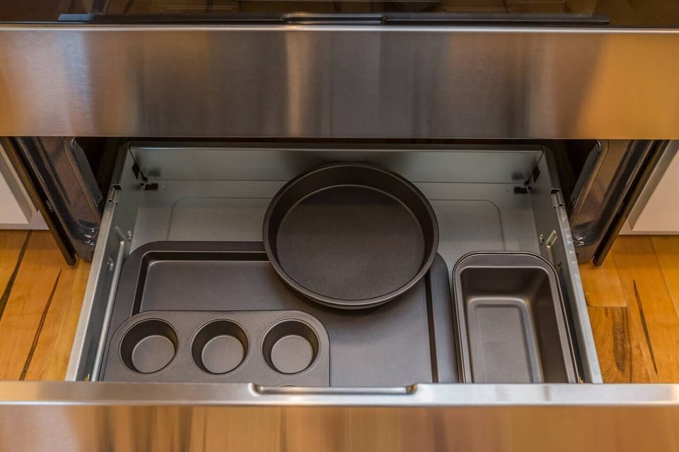 Baking items are located in the tray under the stove
