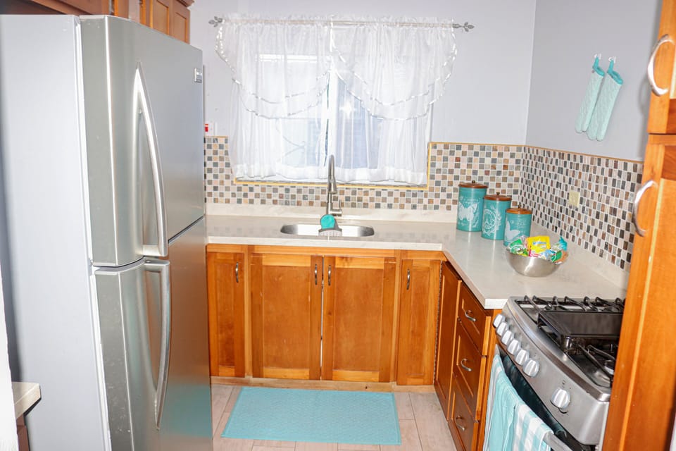 Fully equipped kitchen with stainless steel appliances.