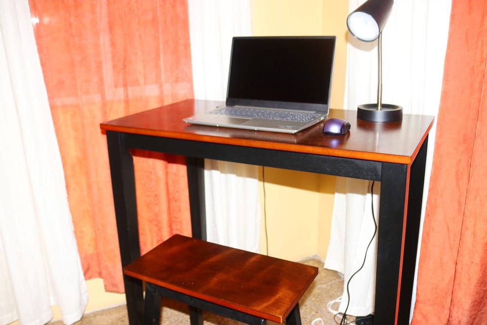 Well-lit work station accommodates business travelers and virtual meetings.