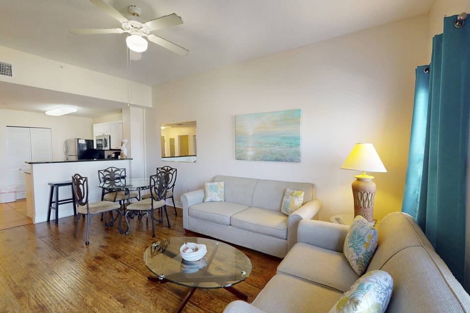 Cozy up in the family room after a day at the beach.  The tall ceilings give a little extra space.