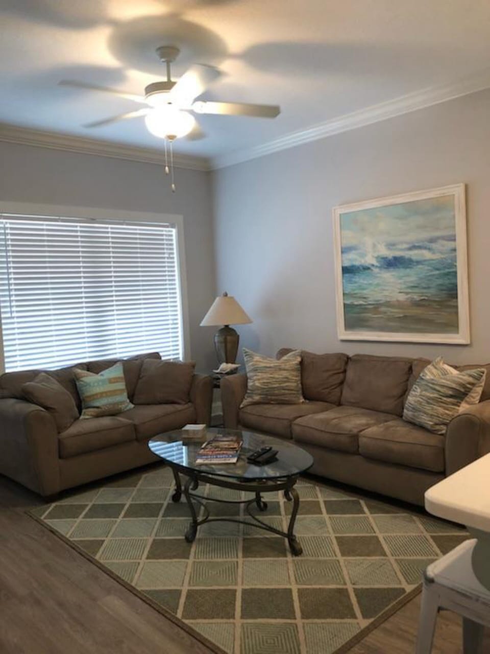 Living room with a full couch and love seat.