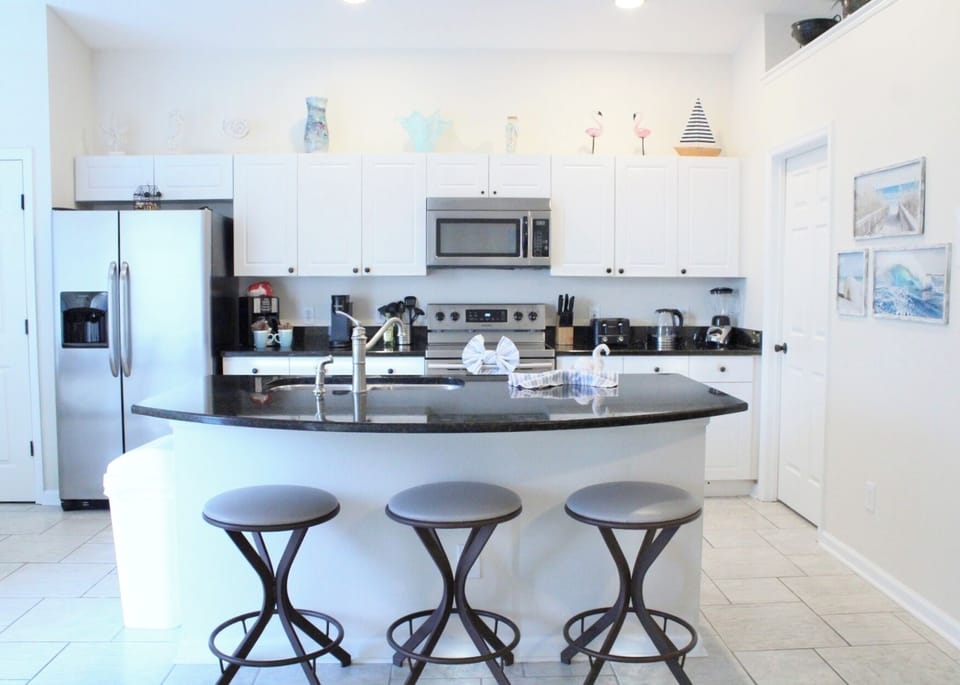 Kitchen with coffee maker, tea kettle, and Keurig.  