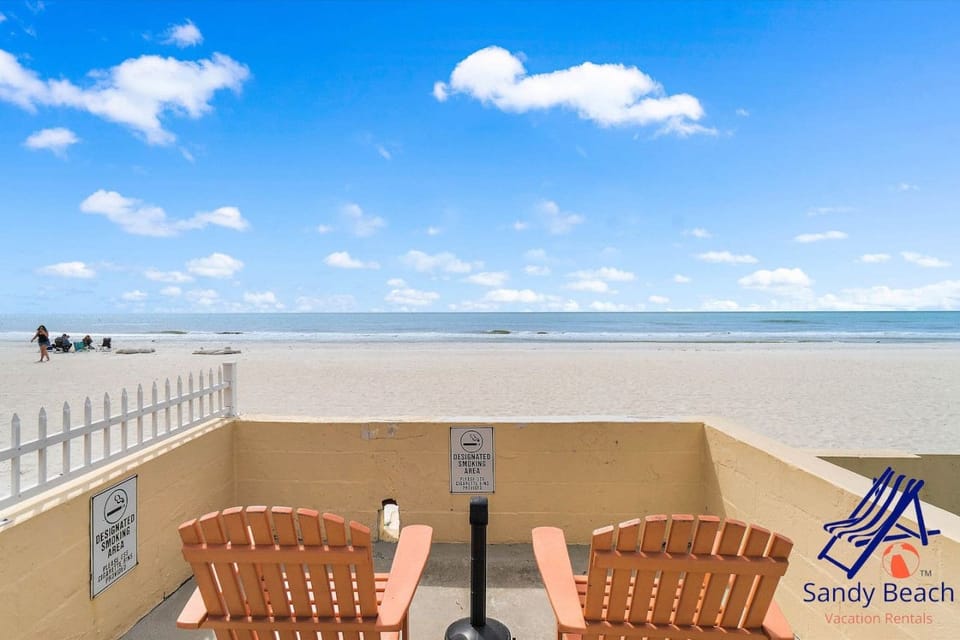 Relax in Adirondack Chairs Overlooking the White Sandy Beach and Sparkling Gulf Waters