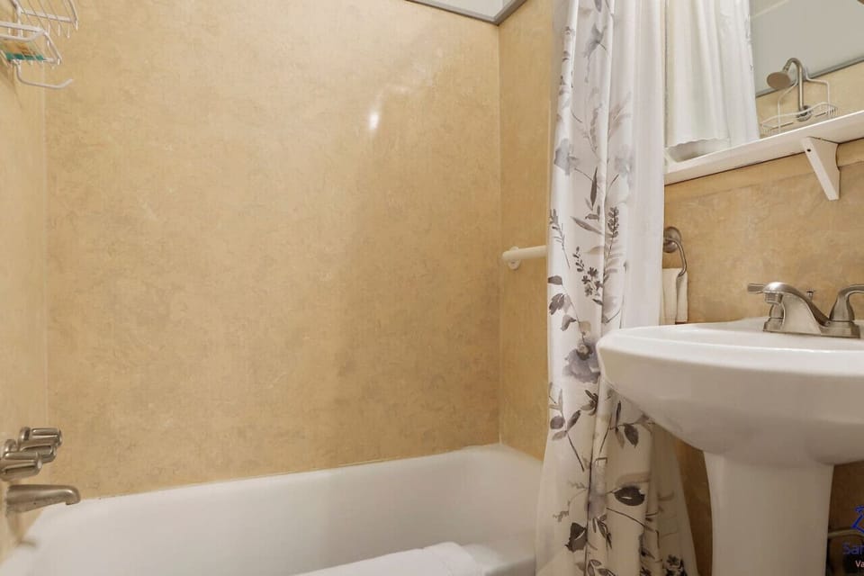 Private Studio Bathroom with Bathtub, Shower Combination & Pedestal Sink